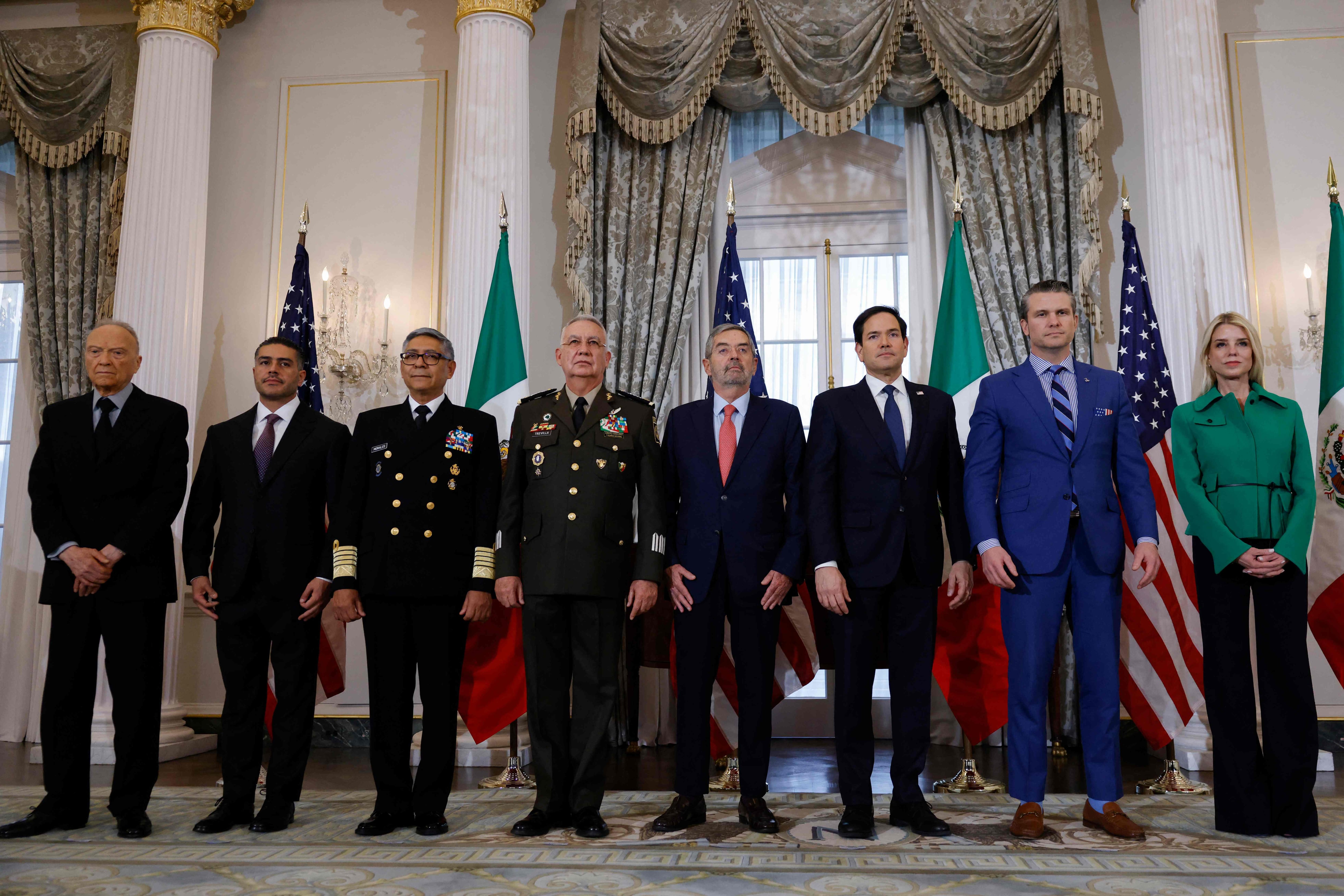 (L/R) Members of the Mexican delegation Attorney General Alejandro Gertz Manero, Secretary of Security and Citizen Protection Omar Garcia Harfuch, Secretary of the Navy Adm. Raymundo Pedro Morales, Secretary of National Defense Gen. Ricardo Trevilla and Secretary of Foreign Affairs Juan Ramon de la Fuente pose with US Secretary of State Marco Rubio, US Secretary of Defense Pete Hegseth and US Attorney General nominee Pam Bondi at the State Department in Washington, DC, on February 27, 2025. (Photo by Ting Shen / AFP)